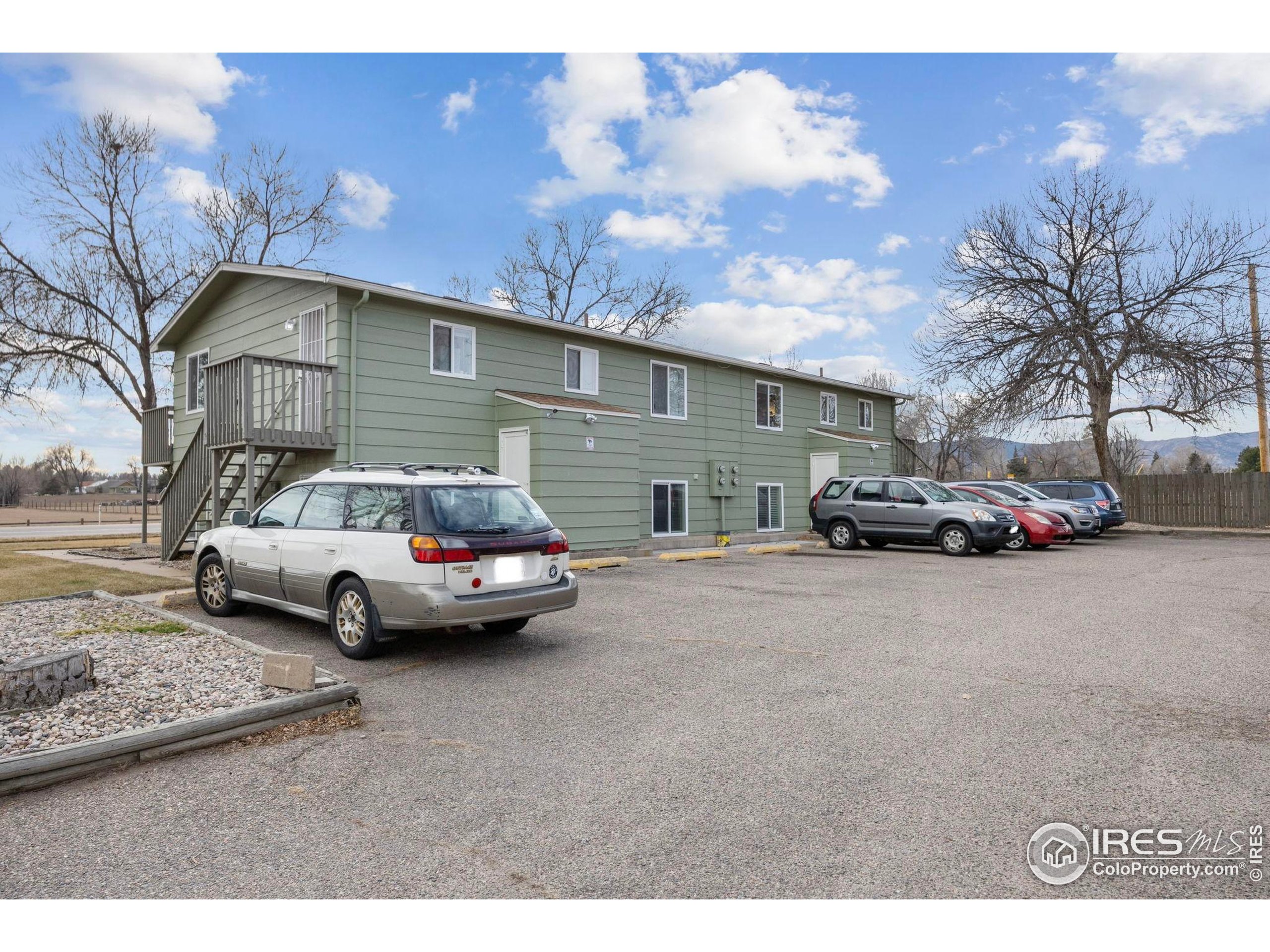 701 Aztec Drive Fort Collins, CO 80521 - Photo 43 of 43 a car parked in front of a house