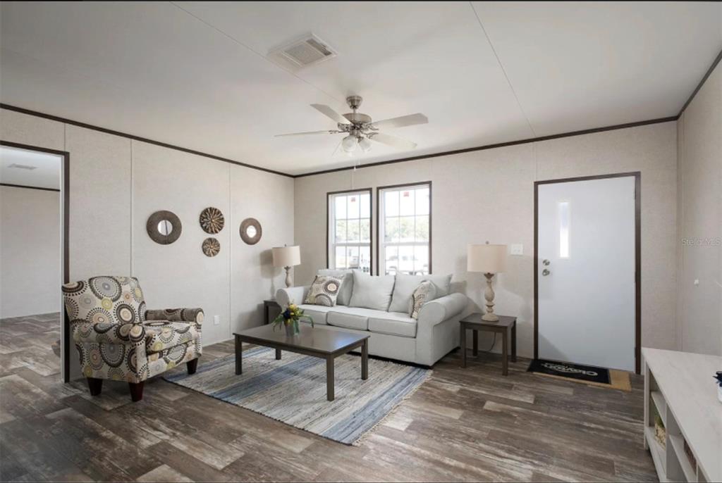 0 Steward Road Eustis, FL 32736 - Photo 4 of 12 a living room with furniture and a large window