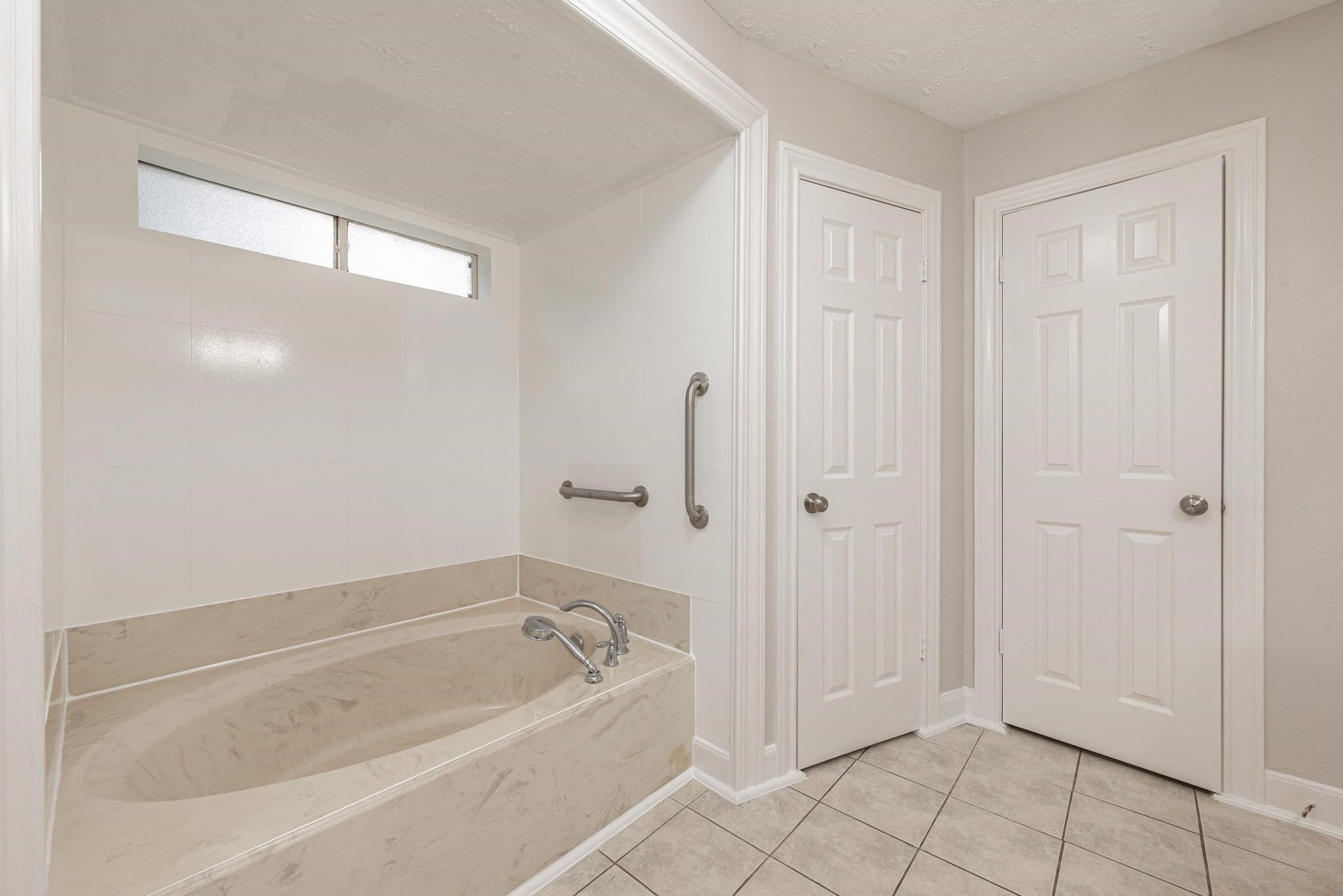 8019 Beaufort Drive Spring, TX 77379 - Photo 32 of 47 a bathroom with a bathtub and shower