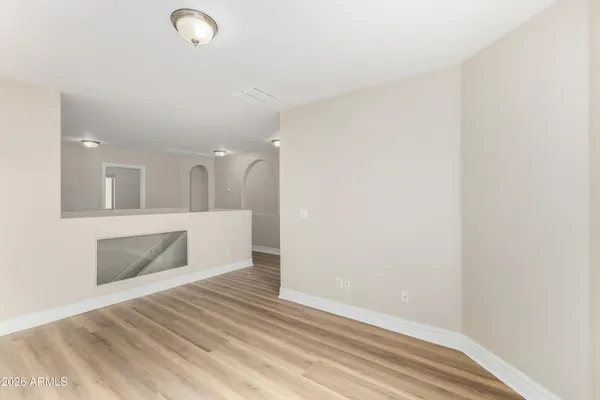 a view of kitchen and an empty room