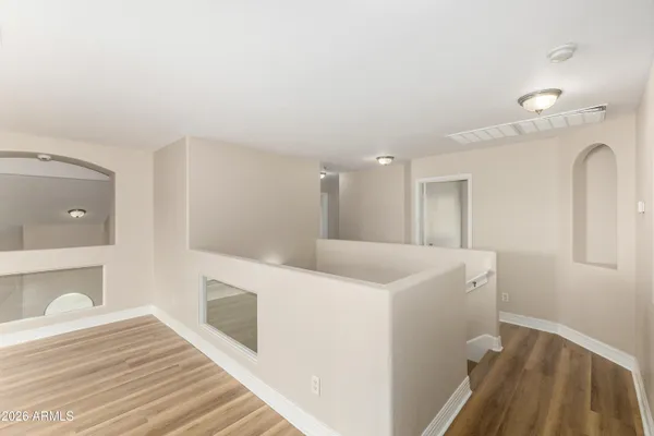 a view of a kitchen from the hallway