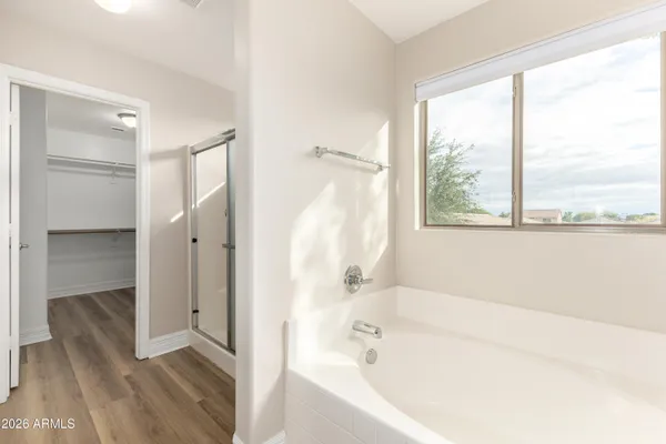 a bathroom with a bathtub and a shower