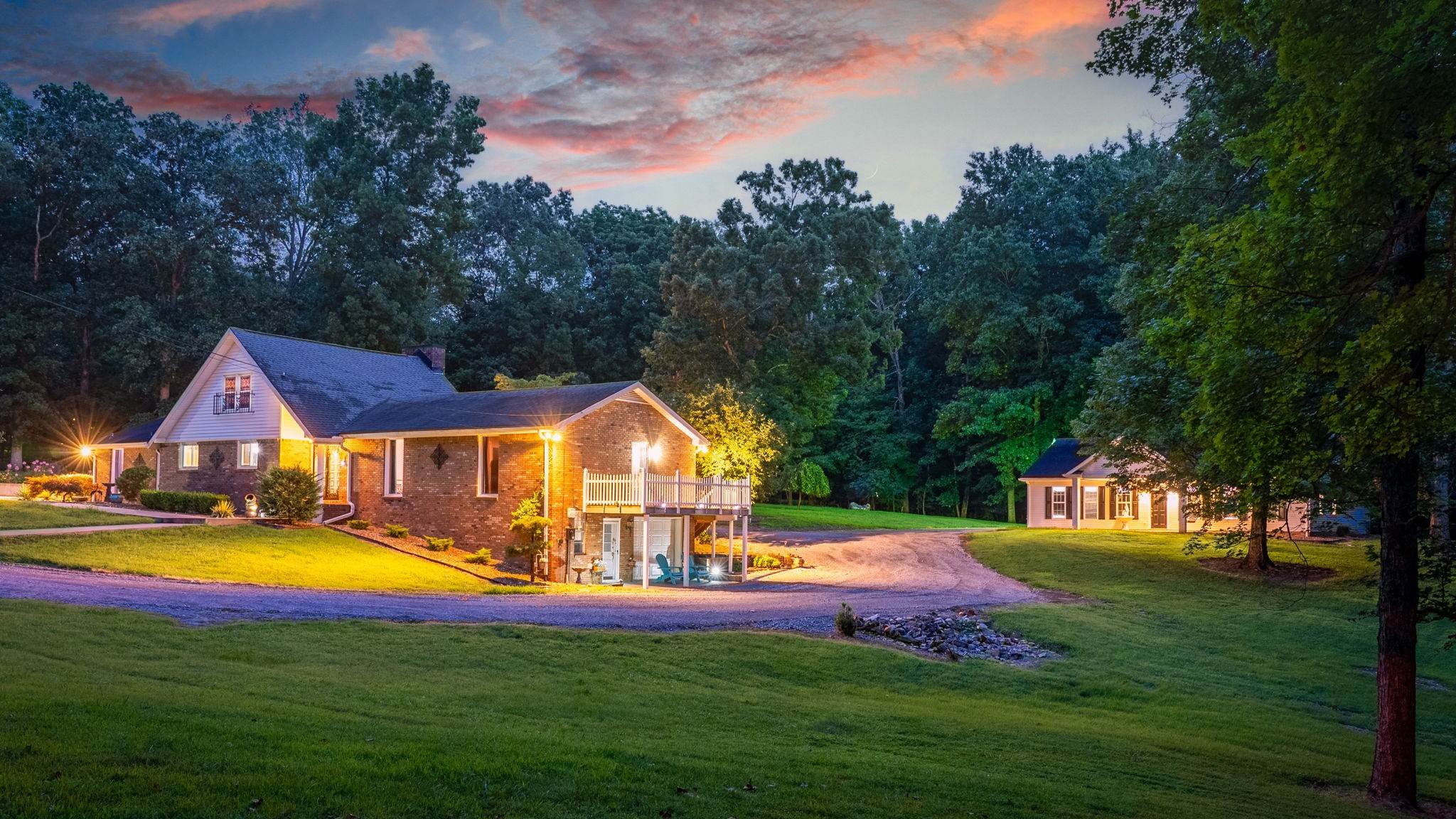 a view of an house with swimming pool and yard