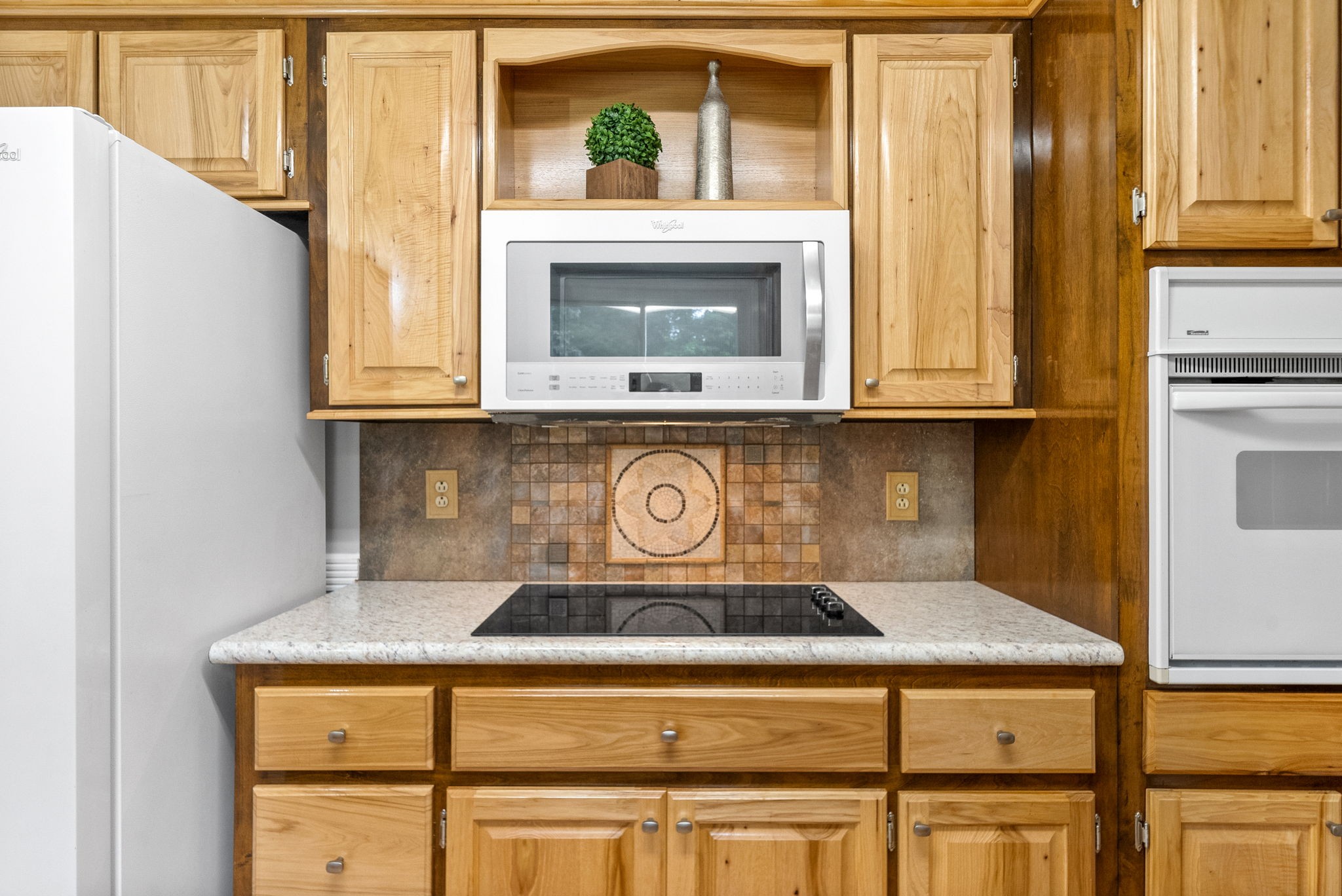 1370 Dunbar Cave Road Clarksville, TN 37043 - Photo 11 of 63 a kitchen with a stove and a microwave