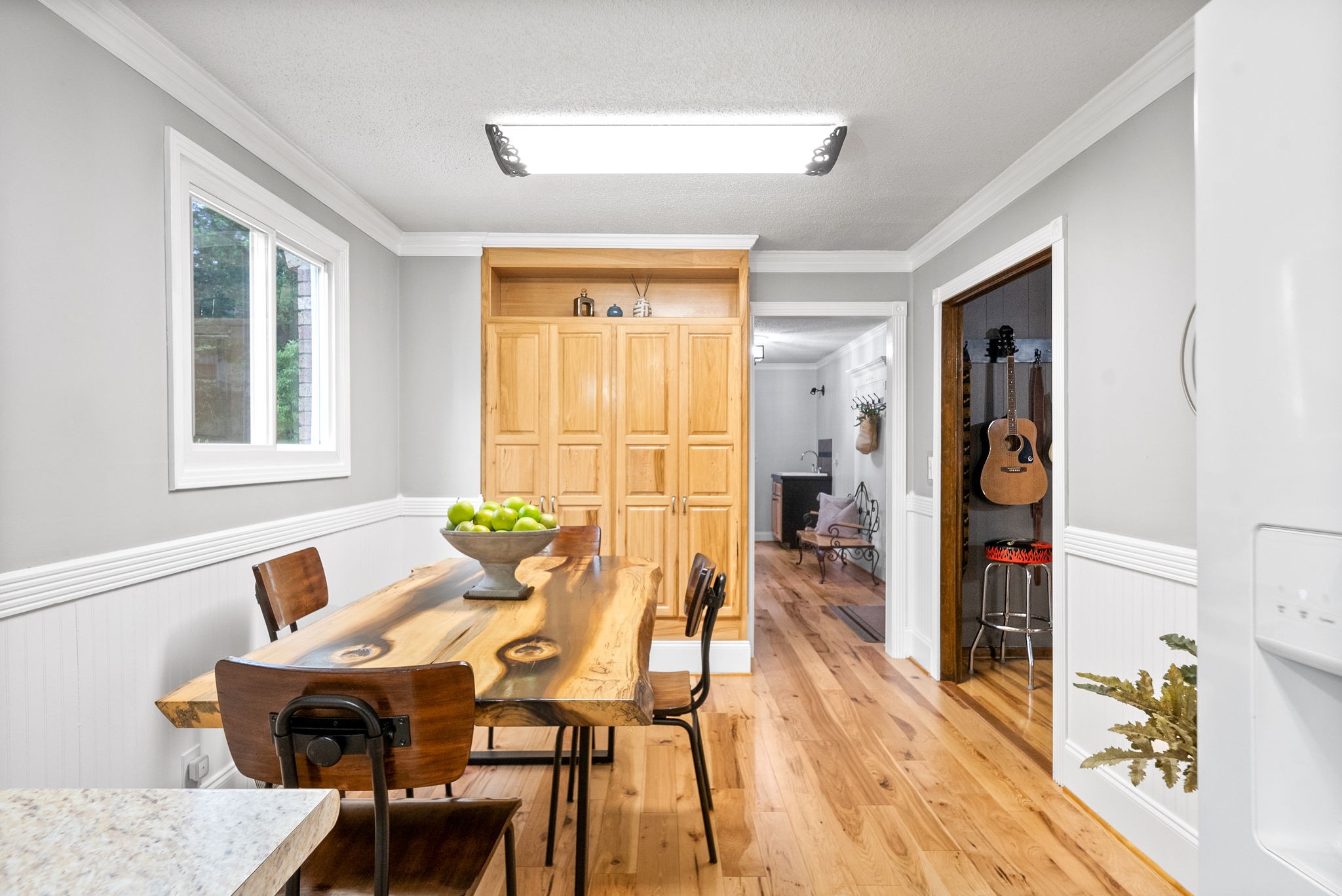 1370 Dunbar Cave Road Clarksville, TN 37043 - Photo 14 of 63 a view of a dining room with furniture and wooden floor
