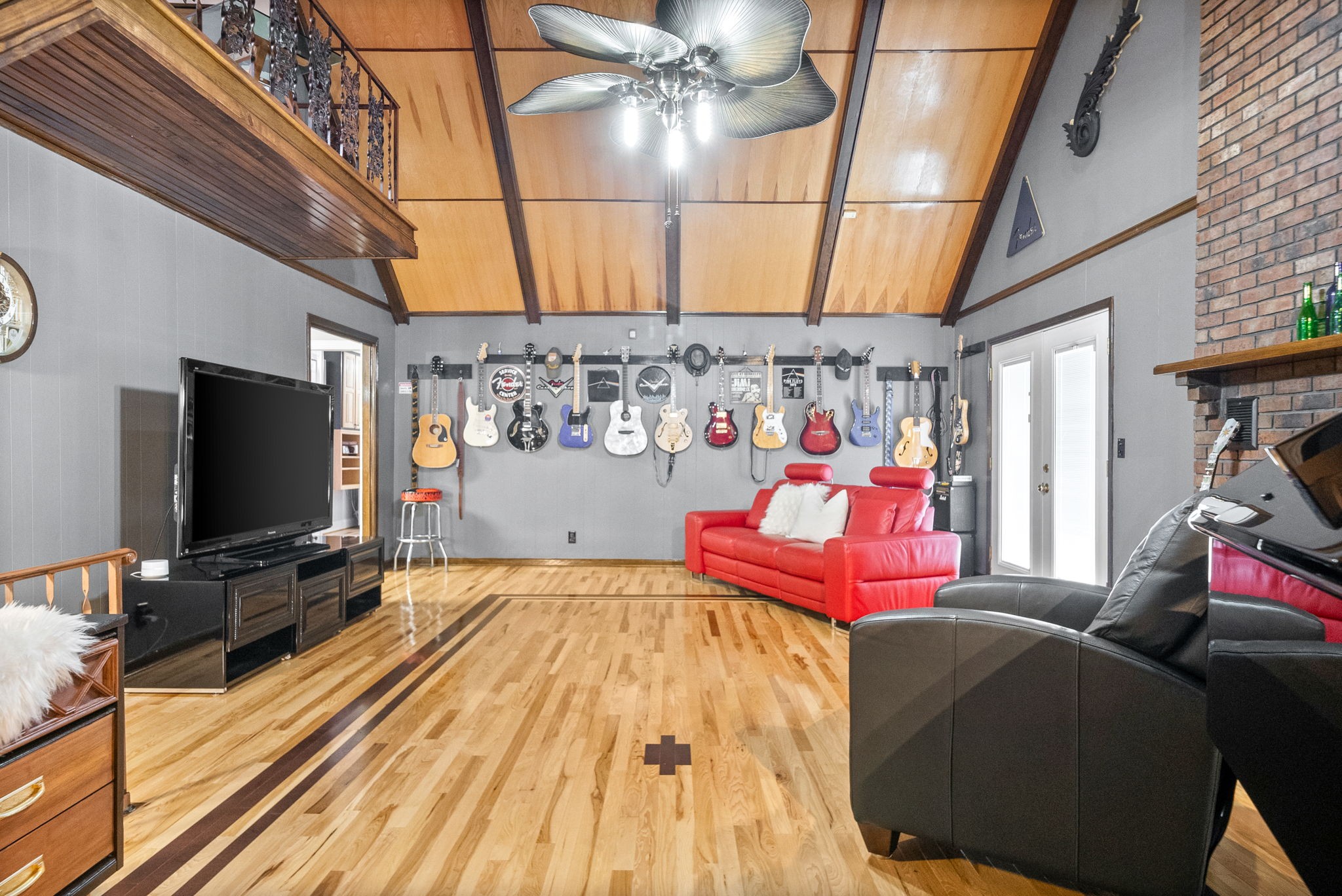 1370 Dunbar Cave Road Clarksville, TN 37043 - Photo 16 of 63 a bedroom with furniture and flat screen tv