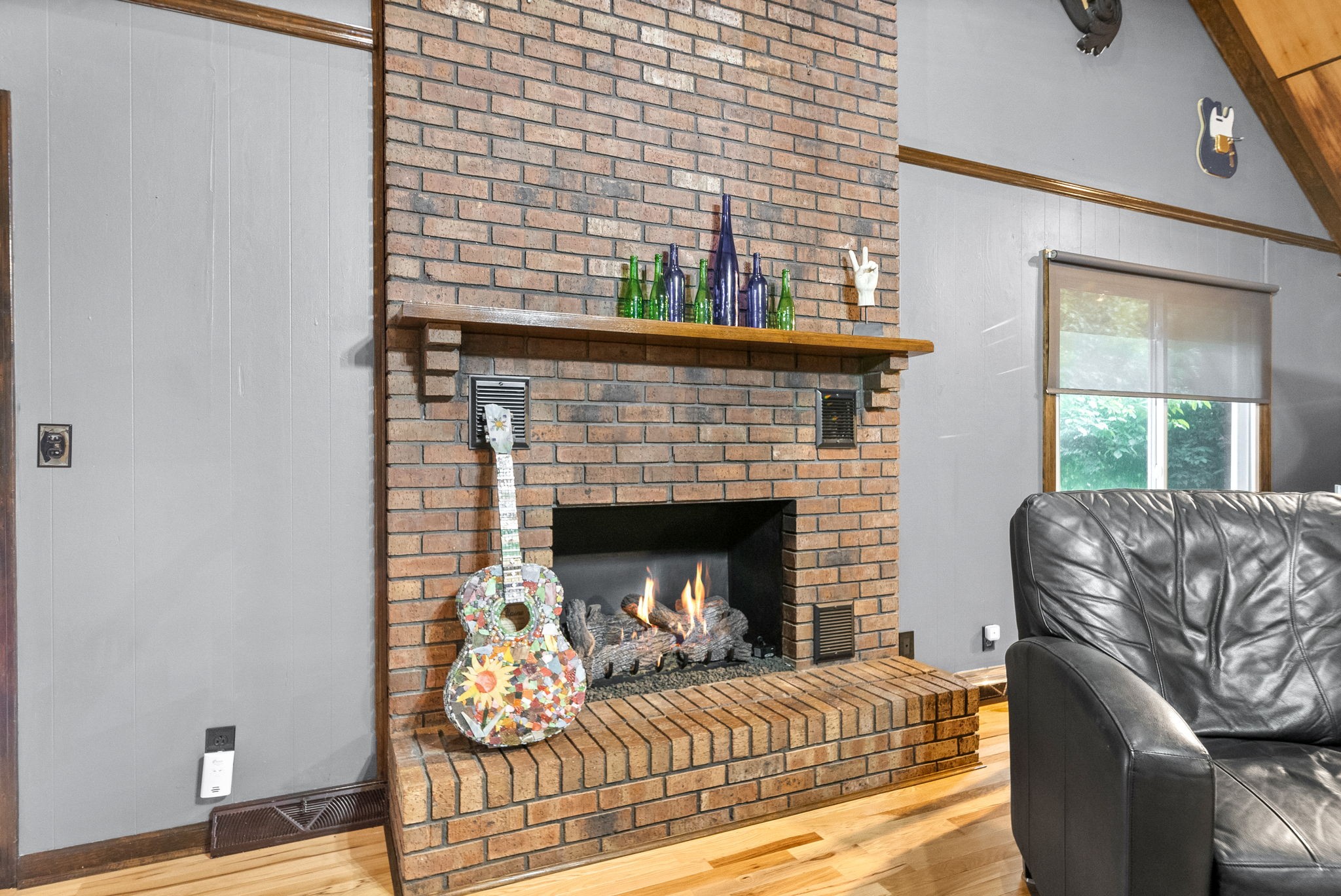 1370 Dunbar Cave Road Clarksville, TN 37043 - Photo 17 of 63 a living room with furniture and a fireplace