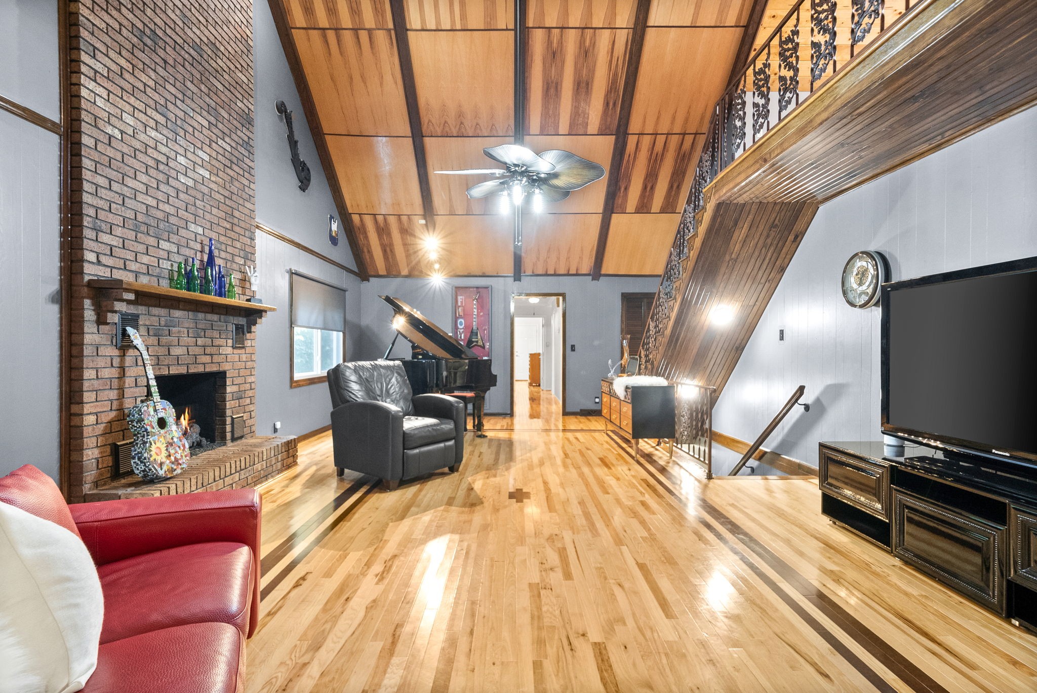 1370 Dunbar Cave Road Clarksville, TN 37043 - Photo 19 of 63 a living room with furniture fireplace and flat screen tv