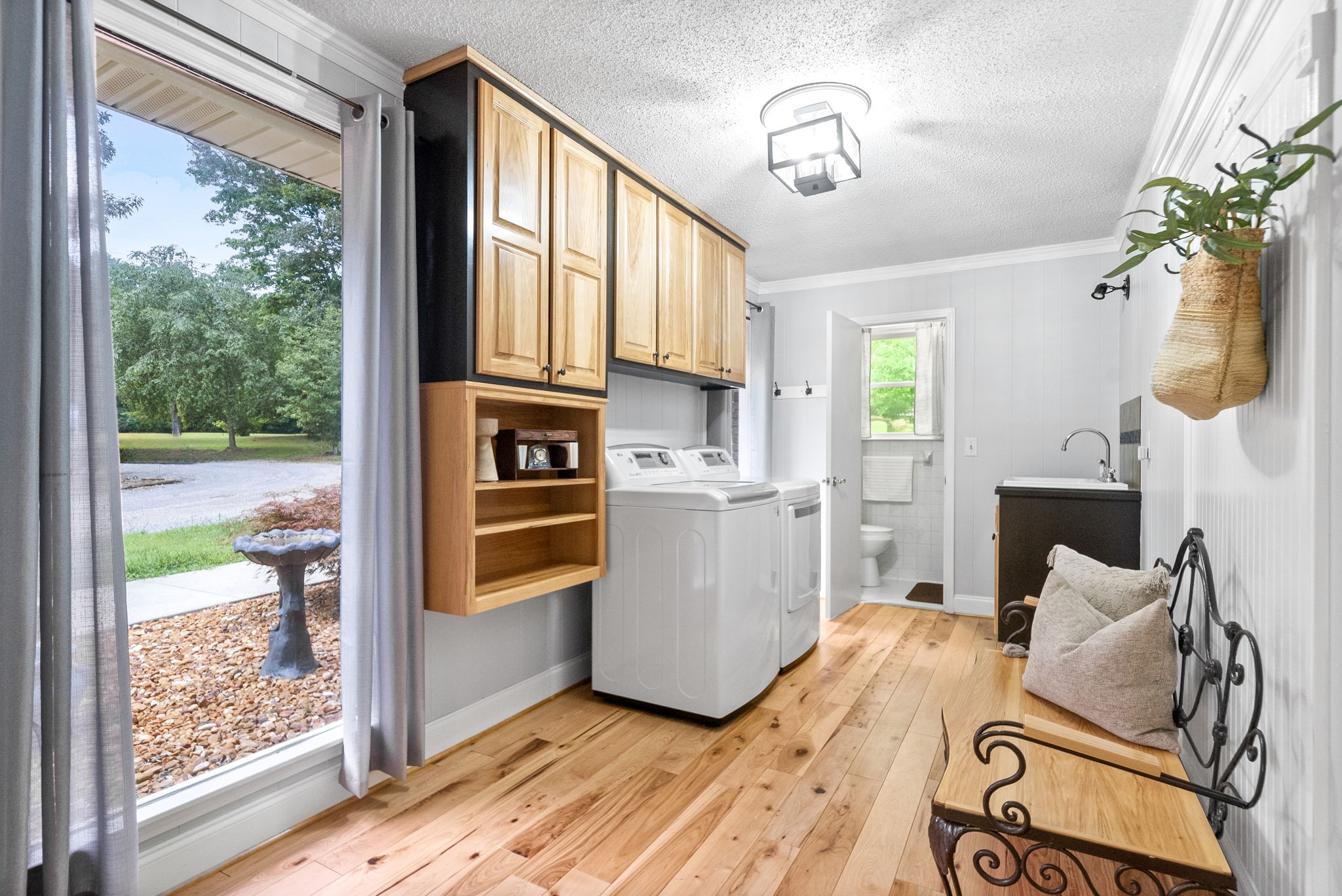 1370 Dunbar Cave Road Clarksville, TN 37043 - Photo 20 of 63 a kitchen with stainless steel appliances granite countertop a refrigerator a oven a white cabinets and wooden floor