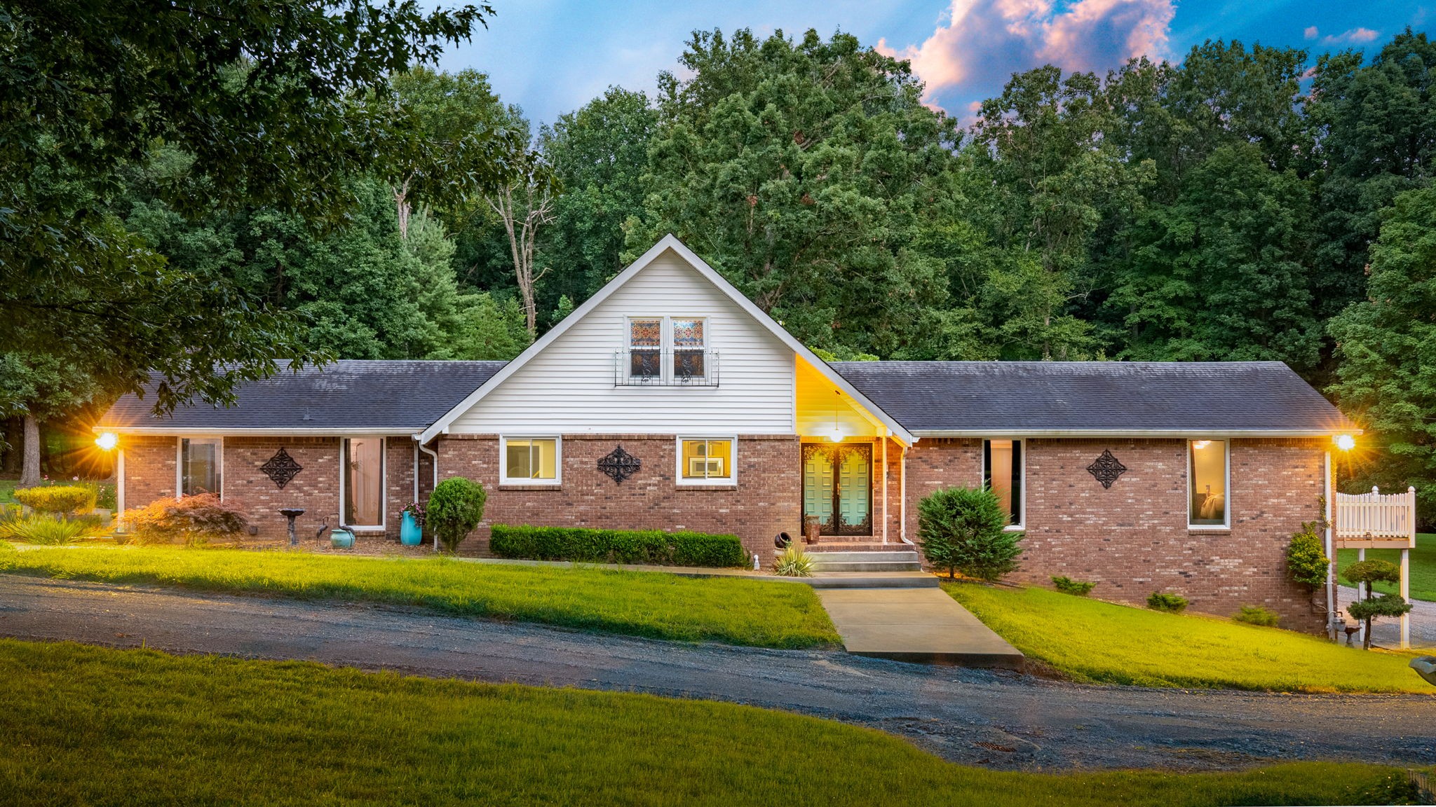 1370 Dunbar Cave Road Clarksville, TN 37043 - Photo 2 of 63 a view of house that has a yard with plants and large trees