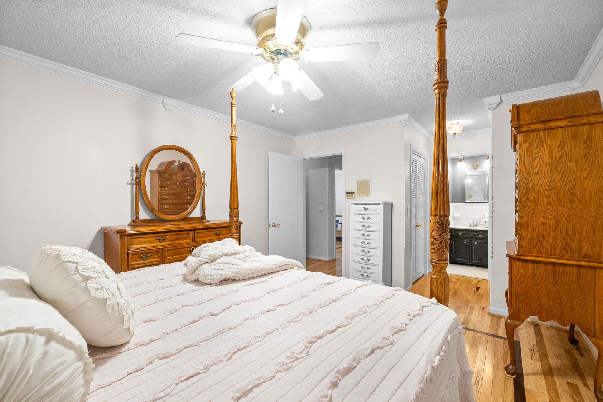 1370 Dunbar Cave Road Clarksville, TN 37043 - Photo 23 of 63 a bedroom with a bed and a chandelier