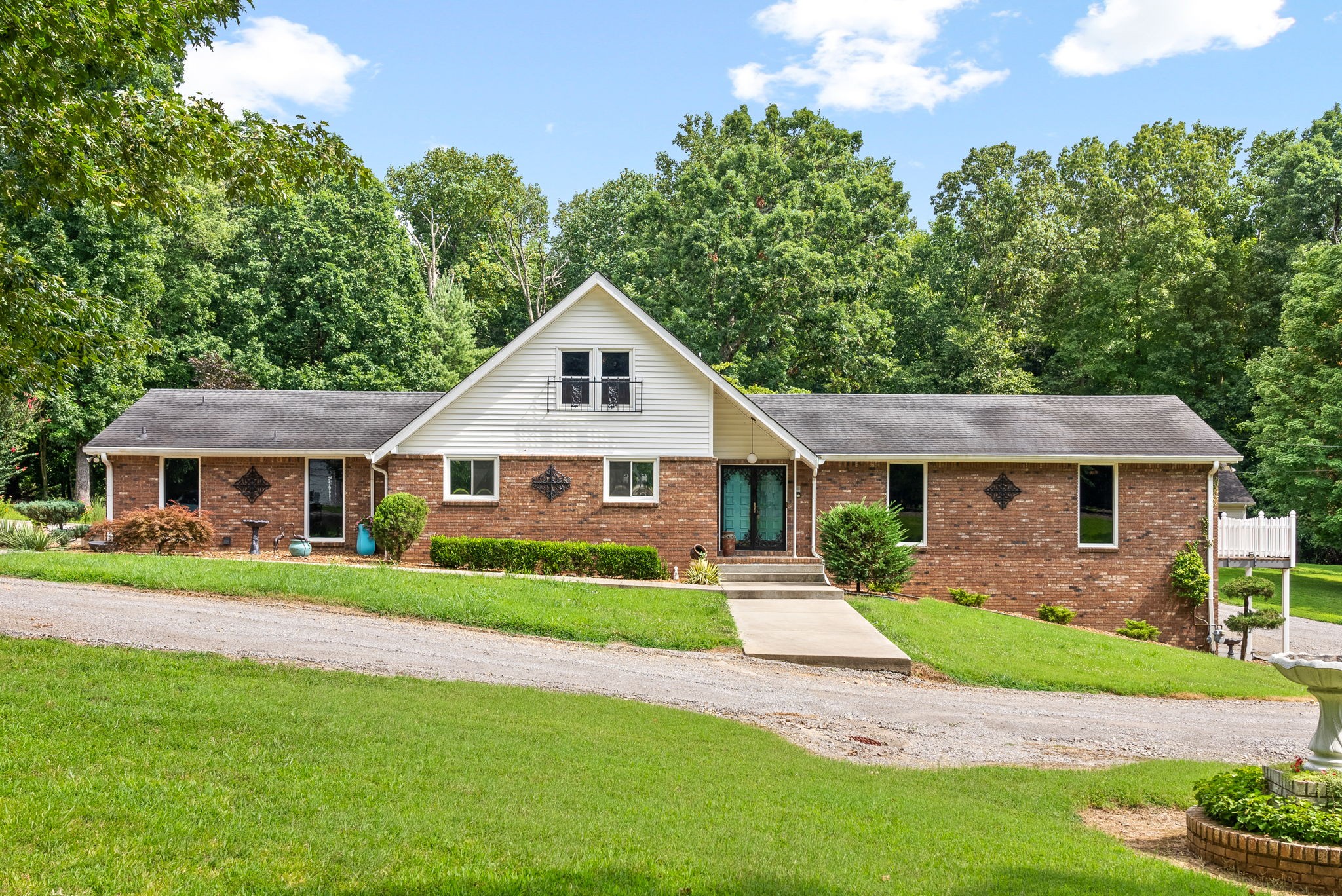 1370 Dunbar Cave Road Clarksville, TN 37043 - Photo 4 of 63 a front view of a house with a yard and garage