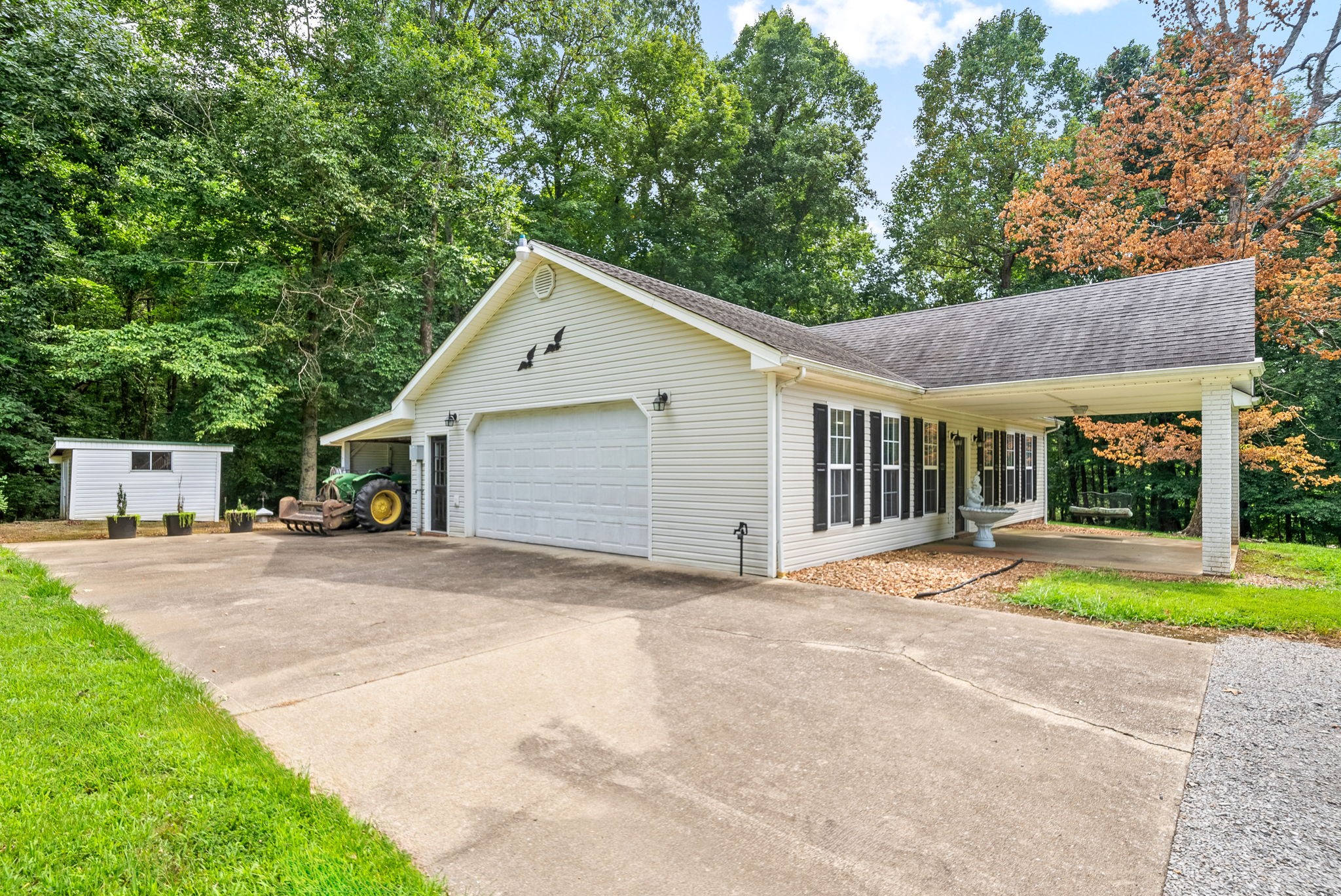 1370 Dunbar Cave Road Clarksville, TN 37043 - Photo 46 of 63 a view of a house with a yard and large tree