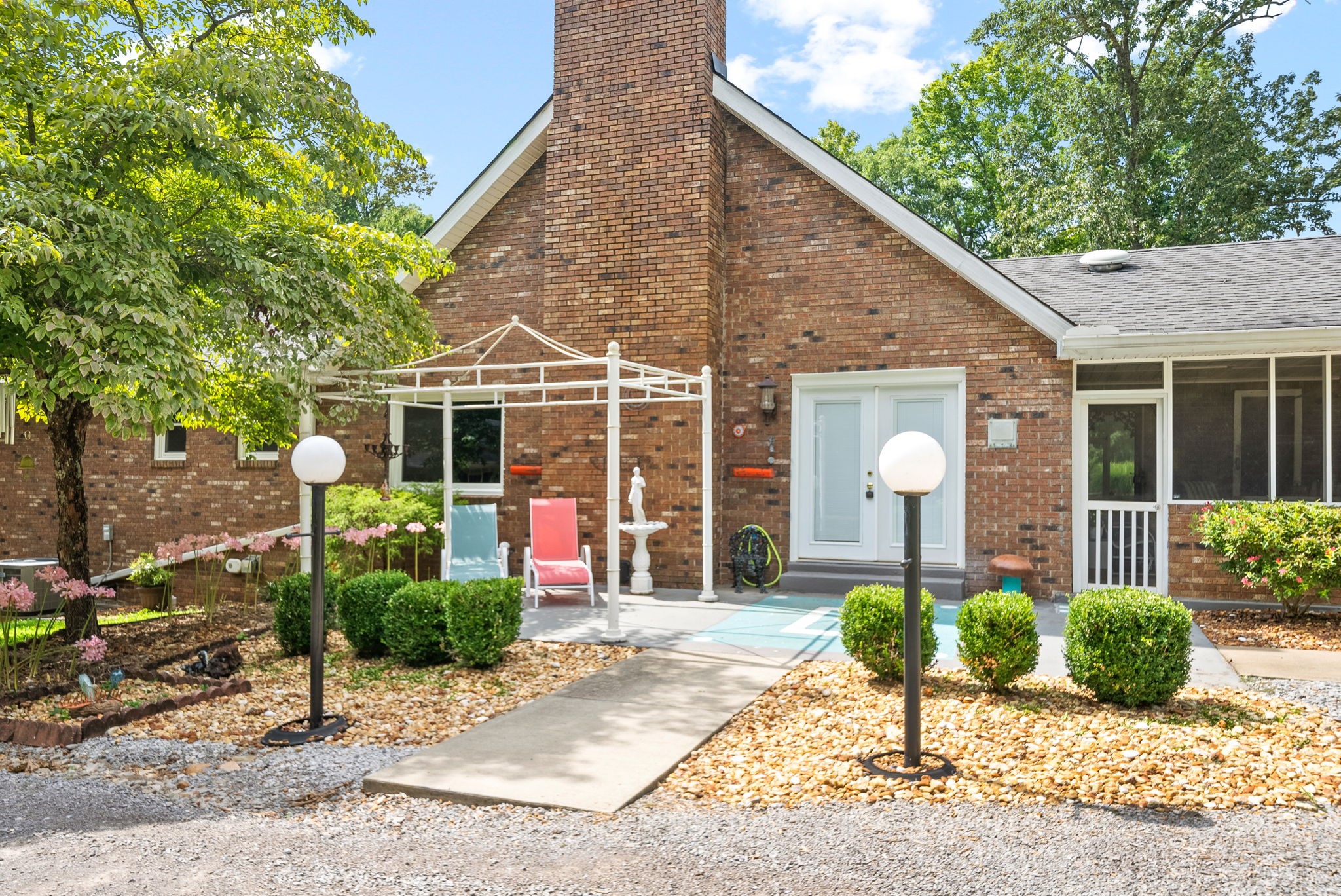 1370 Dunbar Cave Road Clarksville, TN 37043 - Photo 52 of 63 a front view of a house with garden