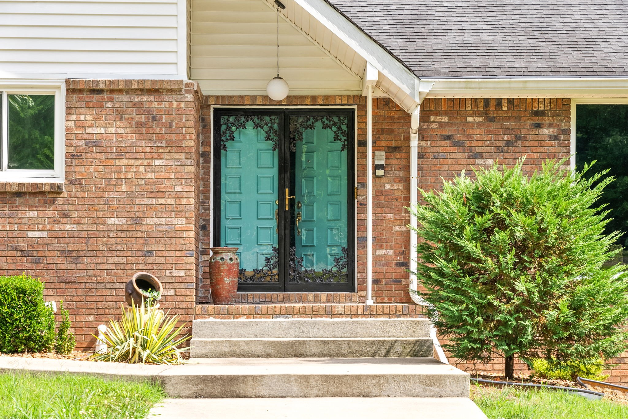 1370 Dunbar Cave Road Clarksville, TN 37043 - Photo 6 of 63 a view of a brick house with a large window