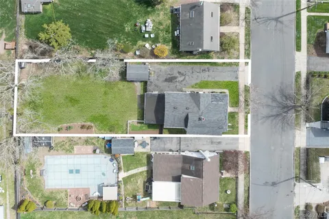 an aerial view of a building with outdoor space