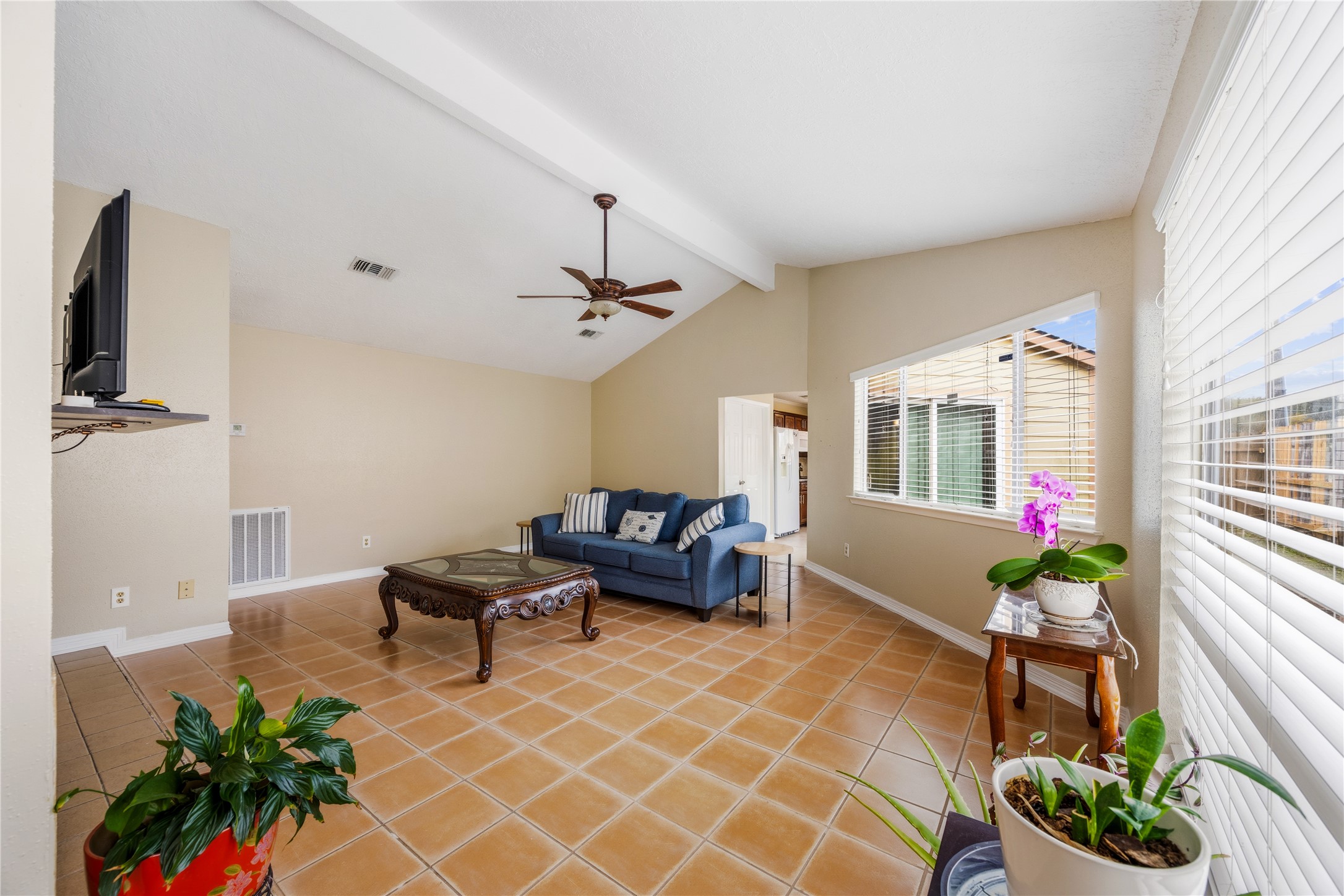 9206 Homeland Drive Houston, TX 77083 - Photo 11 of 39 a living room with furniture and flowers