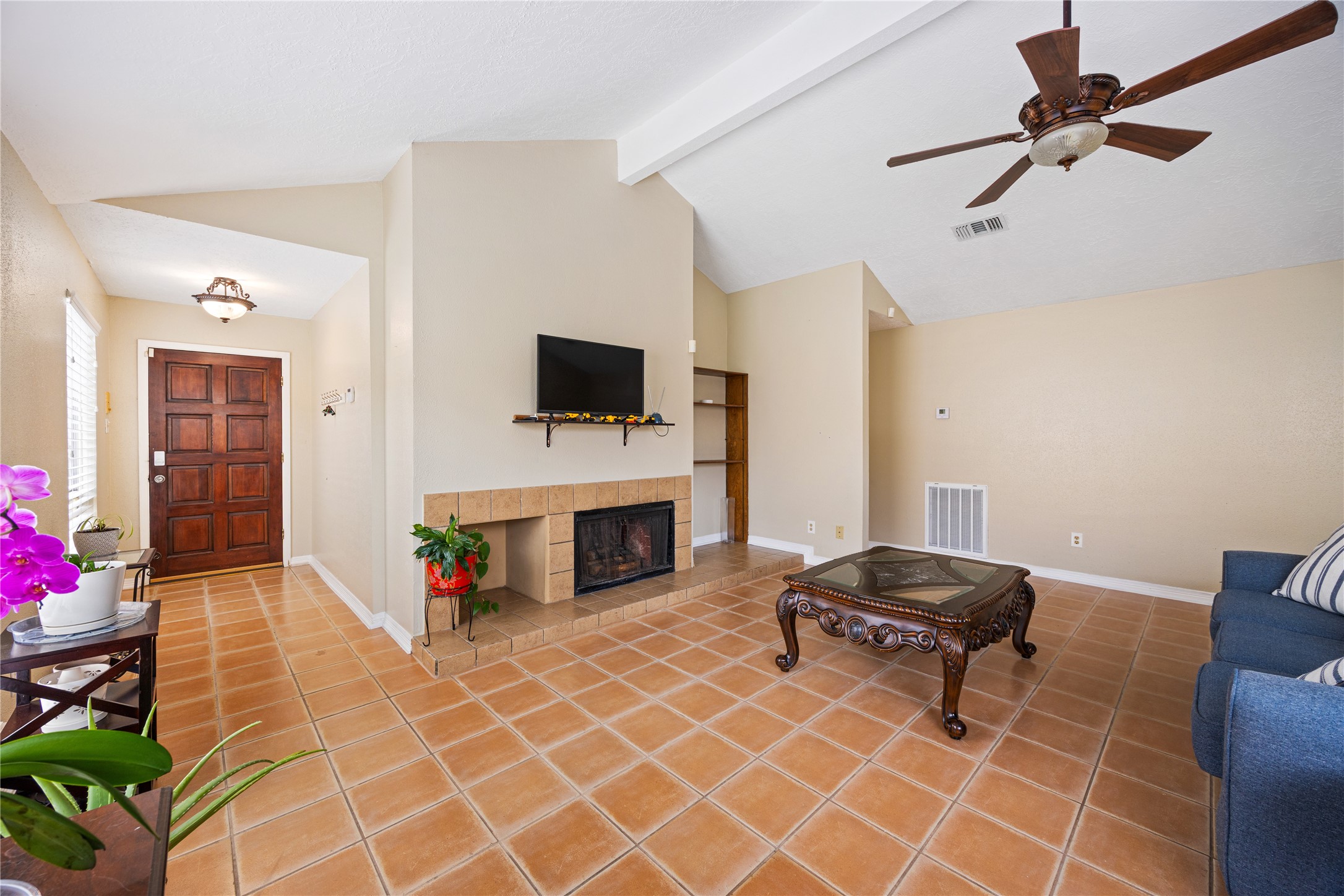 9206 Homeland Drive Houston, TX 77083 - Photo 12 of 39 a living room with furniture and a flat screen tv