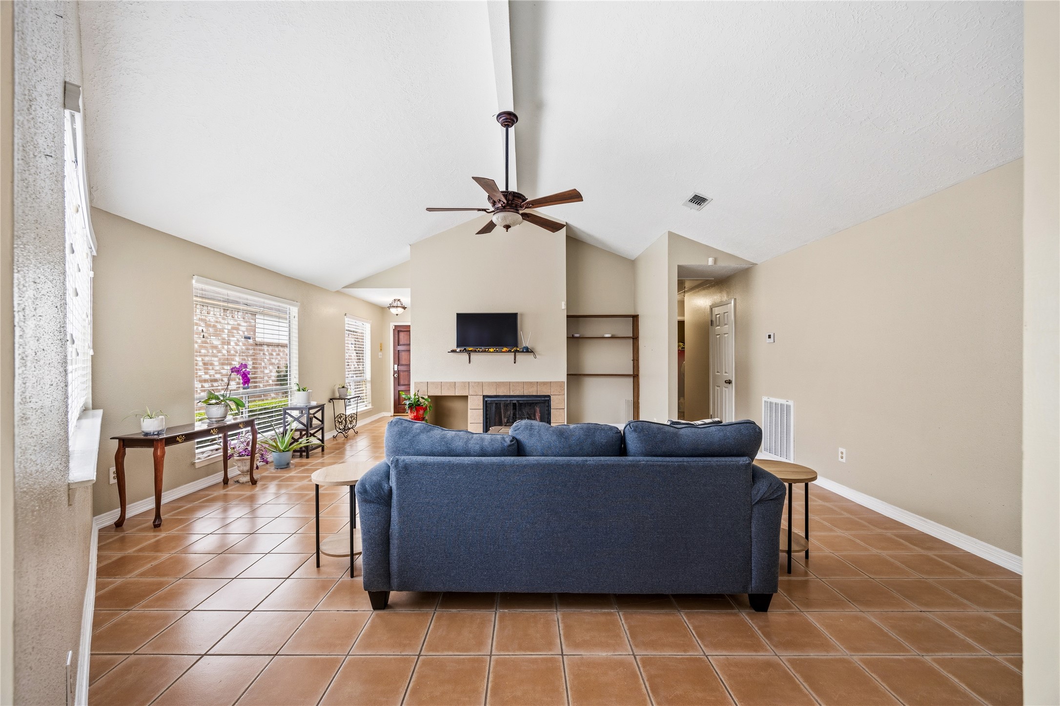 9206 Homeland Drive Houston, TX 77083 - Photo 15 of 39 a living room with furniture a window and a table
