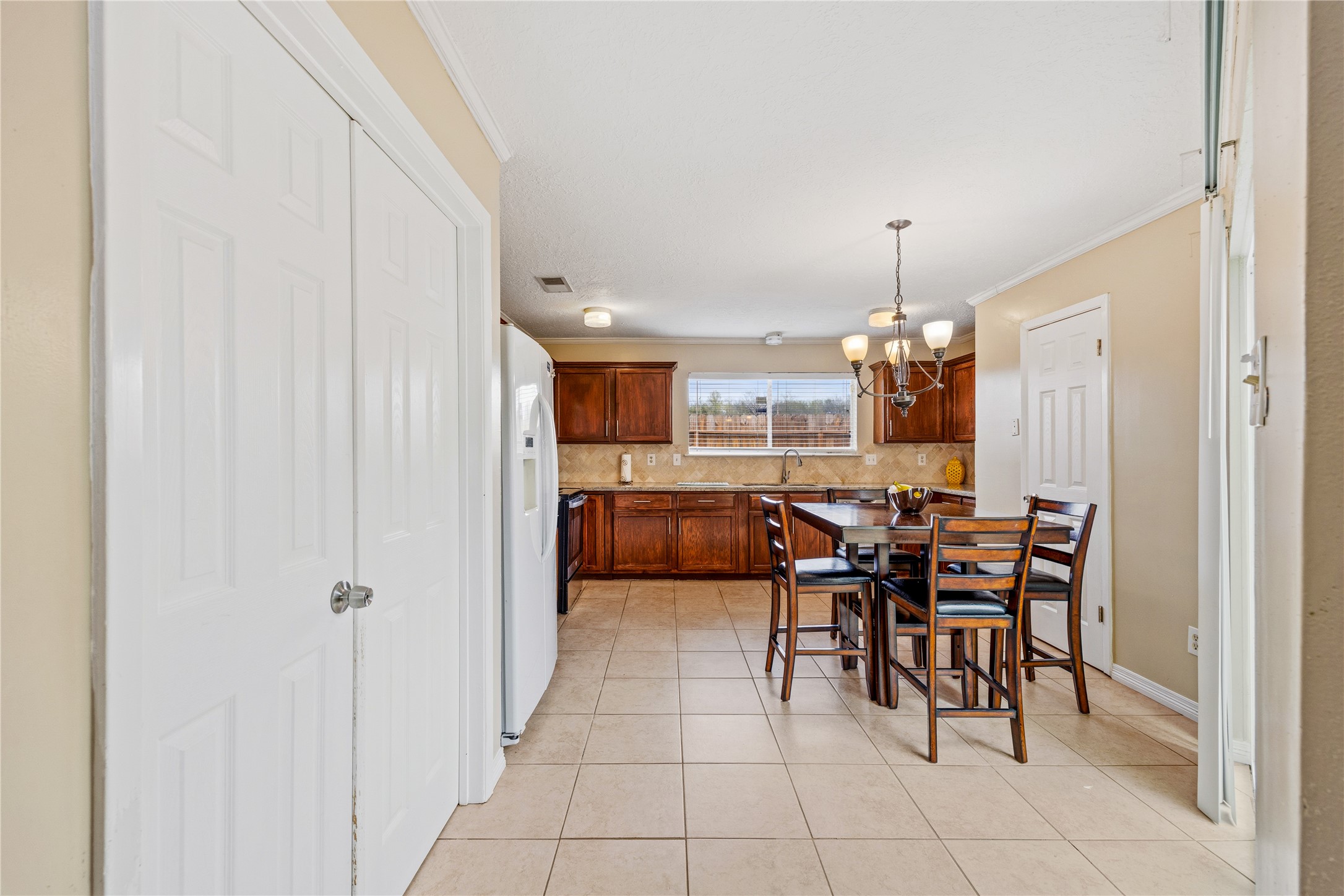 9206 Homeland Drive Houston, TX 77083 - Photo 16 of 39 a view of a dining room with furniture