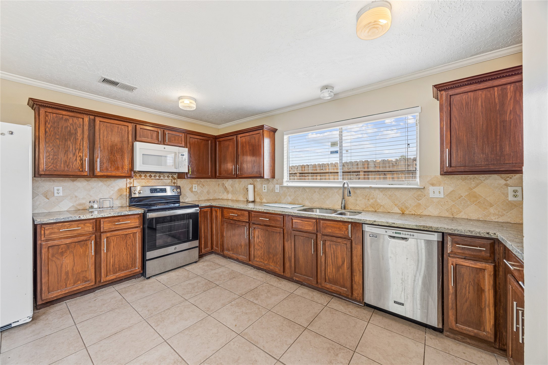 9206 Homeland Drive Houston, TX 77083 - Photo 17 of 39 Stunning renovated kitchen! Feautures abundant cabinet and counter space.