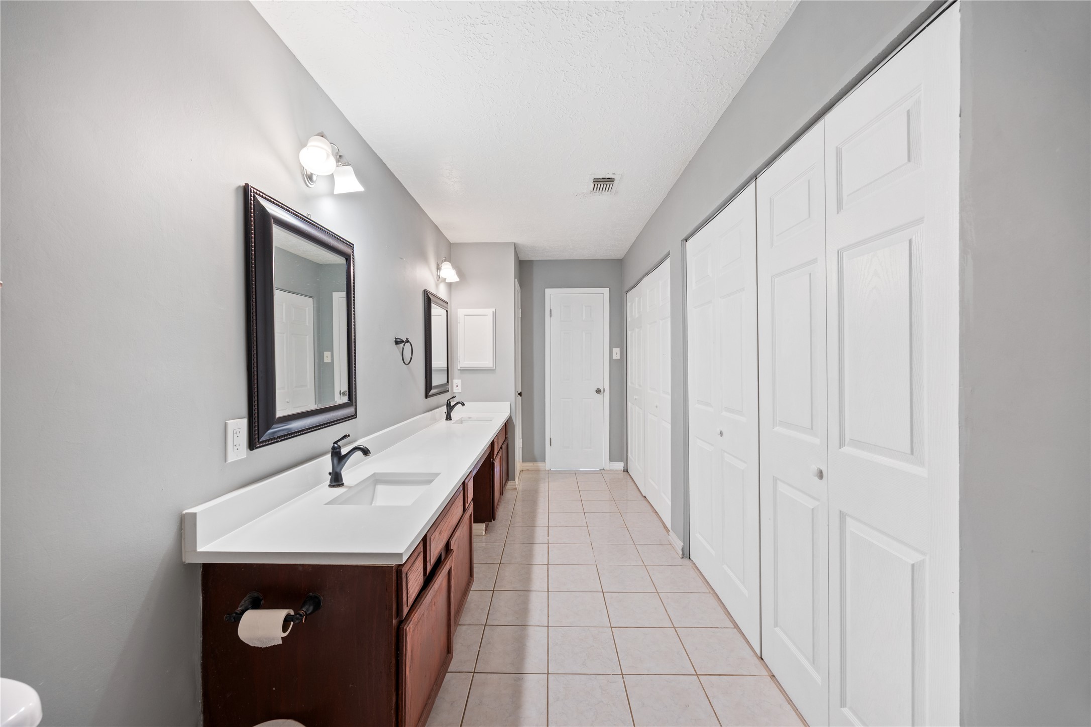 9206 Homeland Drive Houston, TX 77083 - Photo 29 of 39 a bathroom with a sink and mirror