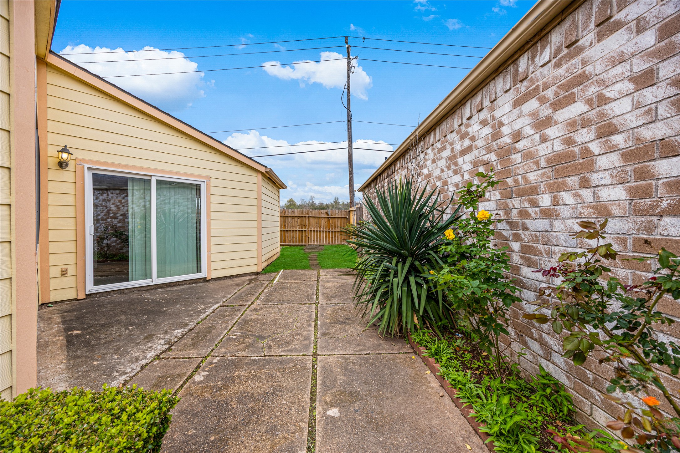 9206 Homeland Drive Houston, TX 77083 - Photo 30 of 39 a house with a yard and potted plants