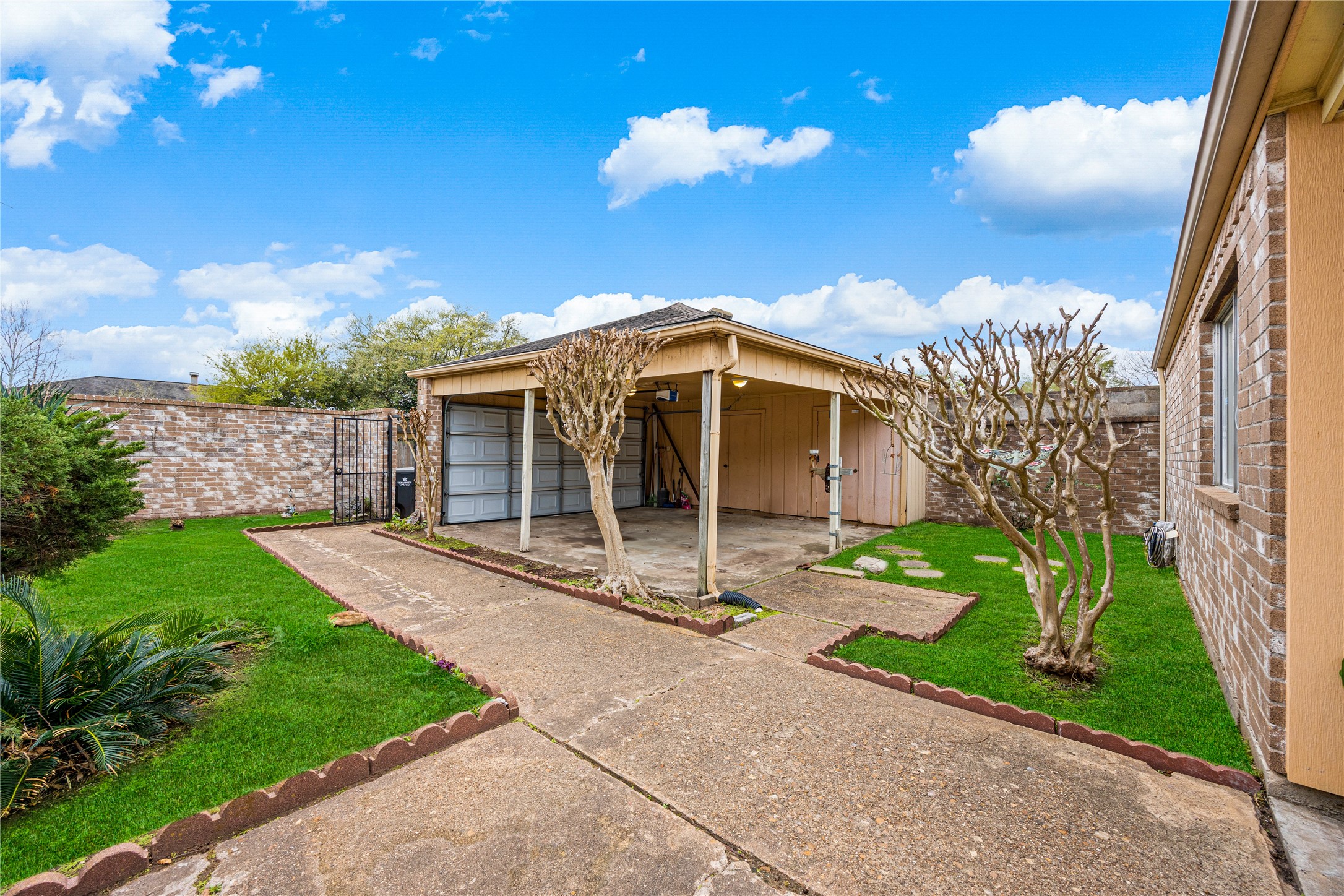 9206 Homeland Drive Houston, TX 77083 - Photo 7 of 39 a front view of a house with garden