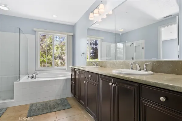 a bathroom with a bathtub and a shower