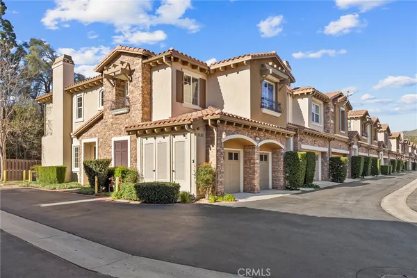 a front view of a house with a garage