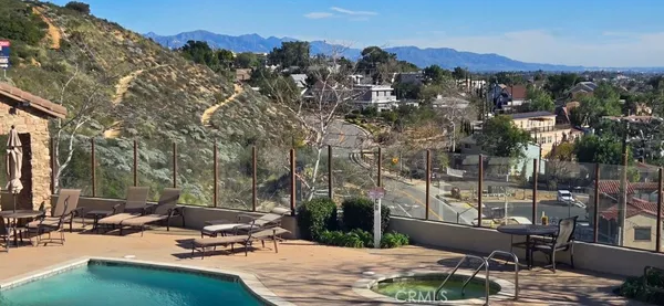 a view of a backyard with sitting area