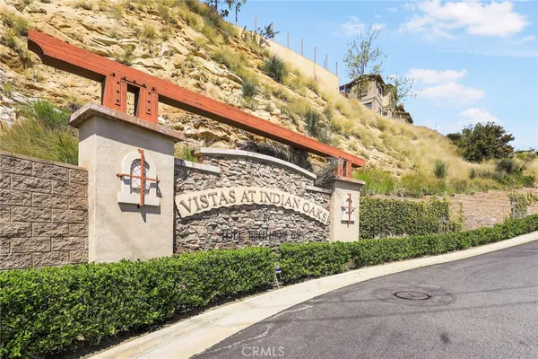 a view of a house with a snow in the background