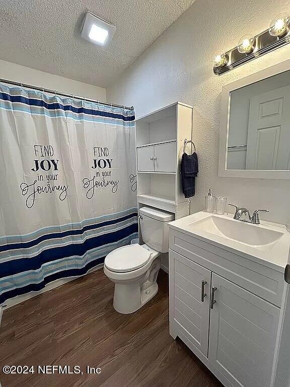 104 Dickens Street Interlachen, FL 32148 - Photo 24 of 24 a bathroom with a toilet sink and mirror