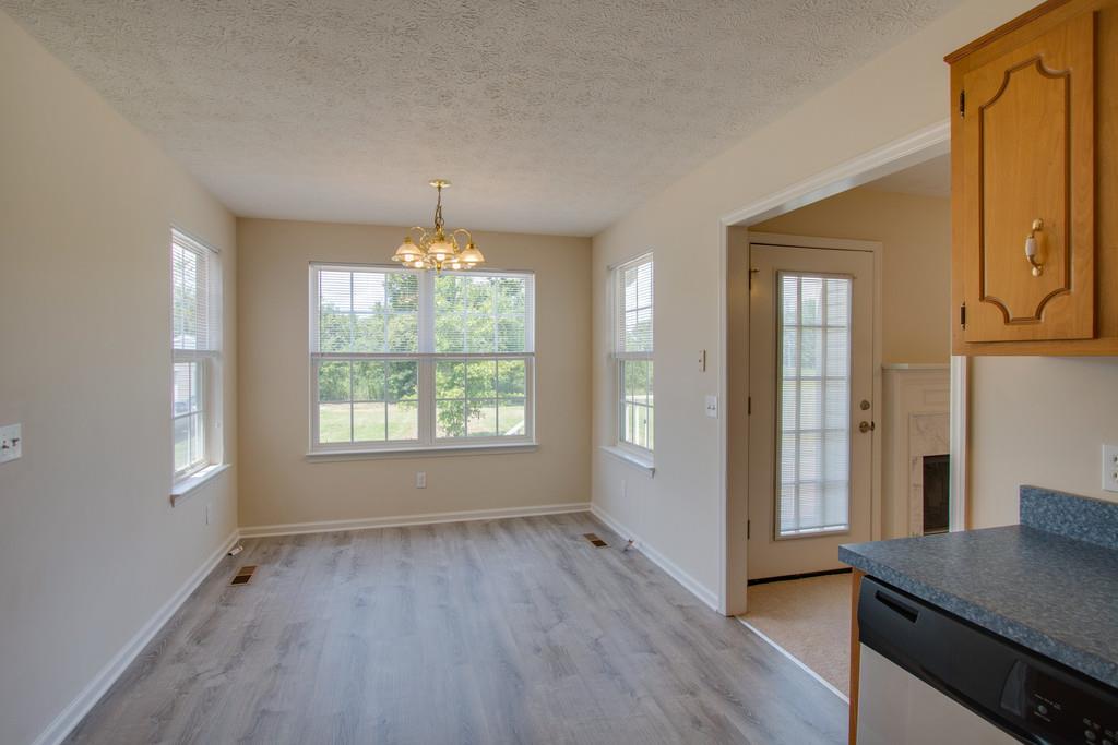 296 Old Shannon Road Lebanon, TN 37090 - Photo 13 of 30 an empty room with wooden floor and windows