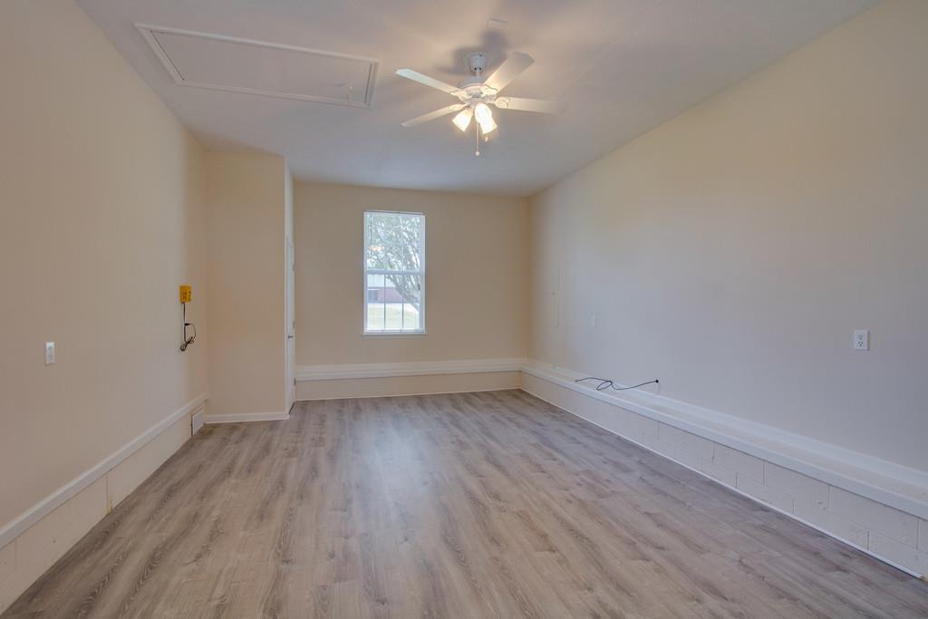 296 Old Shannon Road Lebanon, TN 37090 - Photo 15 of 30 wooden floor in an empty room with a window