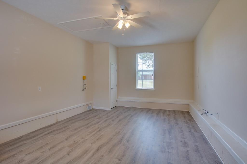 296 Old Shannon Road Lebanon, TN 37090 - Photo 16 of 30 wooden floor in an empty room with a window