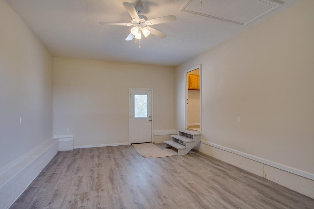 296 Old Shannon Road Lebanon, TN 37090 - Photo 17 of 30 wooden floor in an empty room with a window