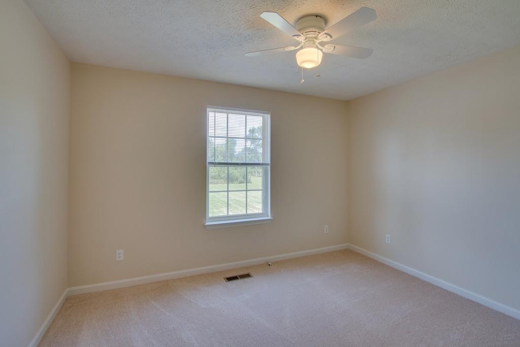 296 Old Shannon Road Lebanon, TN 37090 - Photo 25 of 30 an empty room with a window and a fan