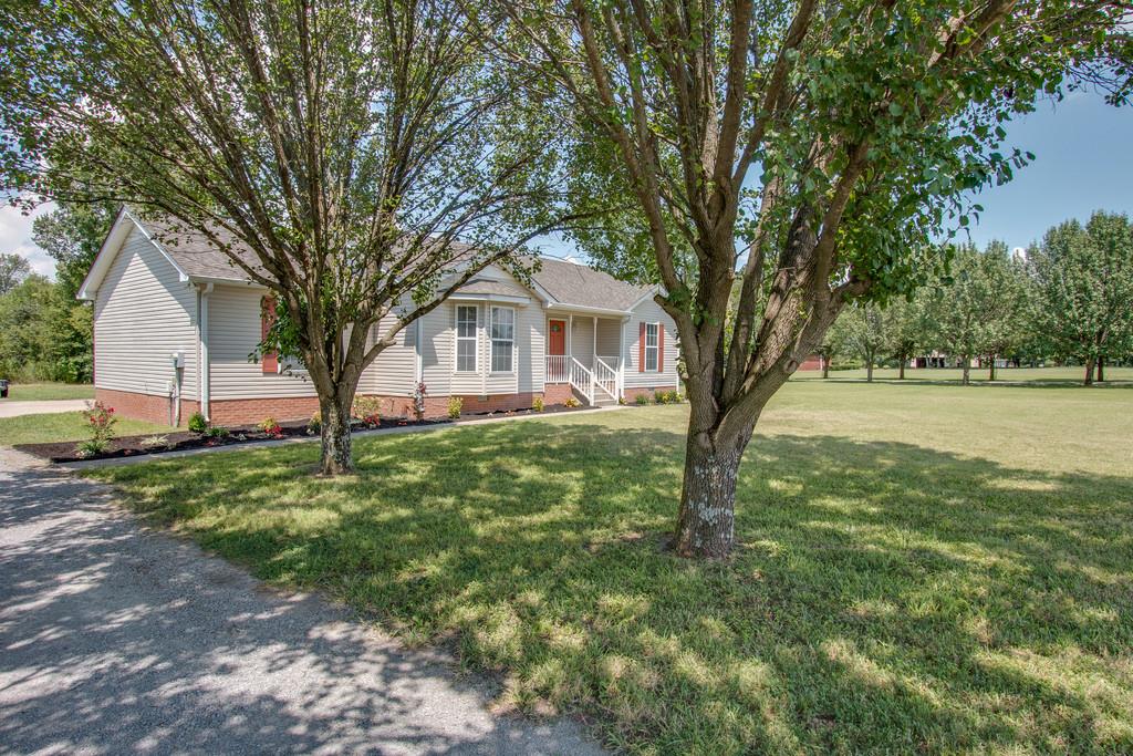 296 Old Shannon Road Lebanon, TN 37090 - Photo 4 of 30 a front view of a house with a garden