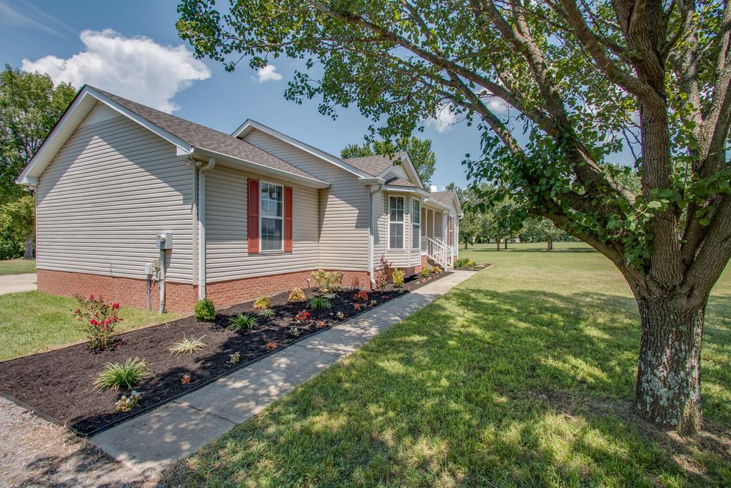 296 Old Shannon Road Lebanon, TN 37090 - Photo 5 of 30 a backyard of a house with lots of green space