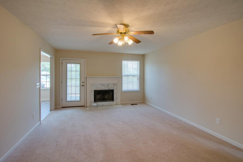 296 Old Shannon Road Lebanon, TN 37090 - Photo 6 of 30 an empty room with windows and fireplace