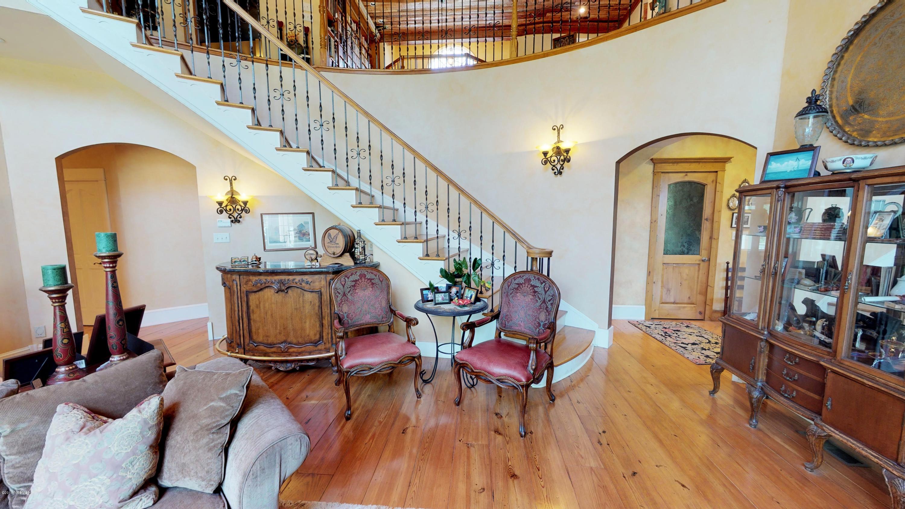 1600 Pasture Point Road Merritt, NC 28556 - Photo 34 of 116 Wet Bar under Custom Curved Staircase