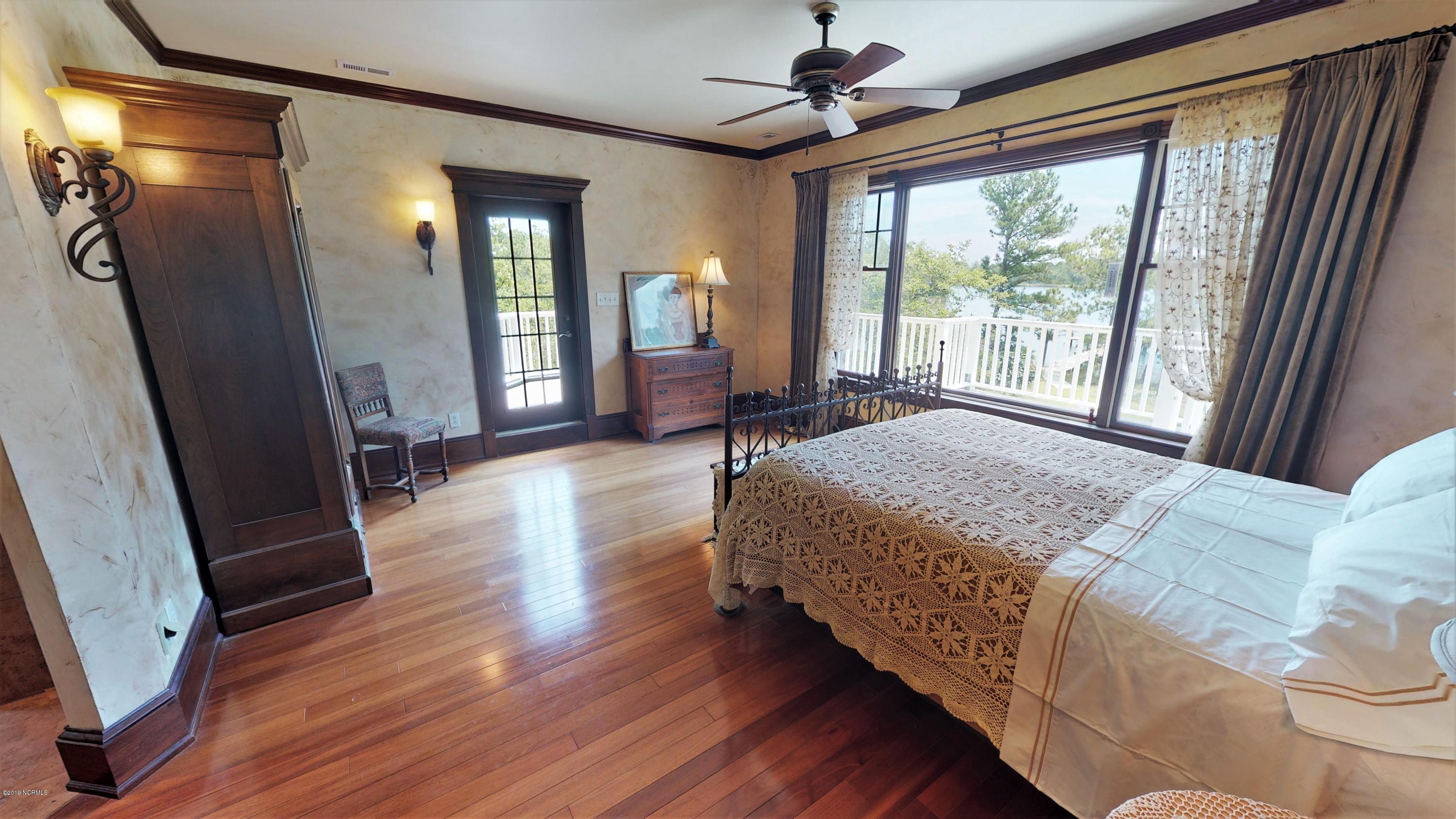 1600 Pasture Point Road Merritt, NC 28556 - Photo 62 of 116 Master Bedroom Suite to Private Deck