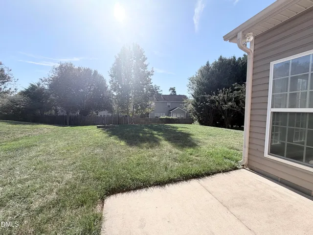 a view of backyard with green space