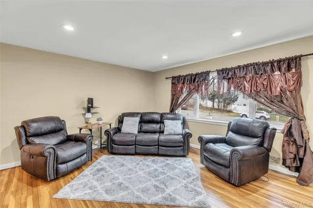 a living room with furniture and a rug