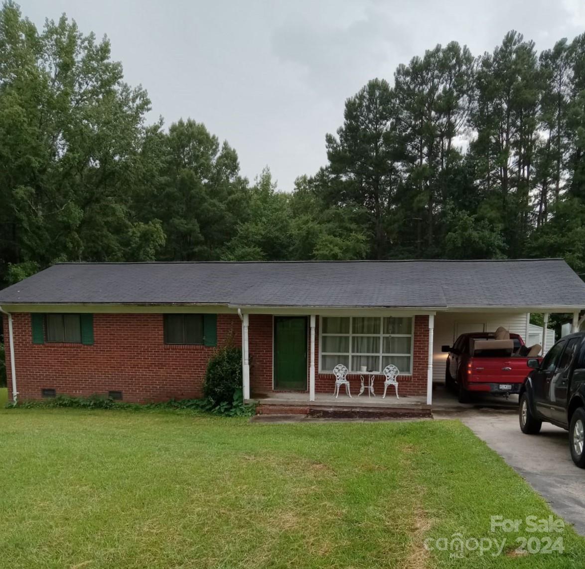 2262 Mountain Laurel Road Lancaster, SC 29720 - Photo 1 of 1 a front view of a house with a garden