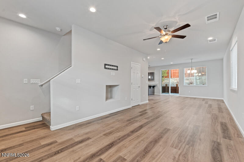 3622 Ruidoso Street Reno, NV 89512 - Photo 2 of 16 a view of an empty room with a window and wooden floor