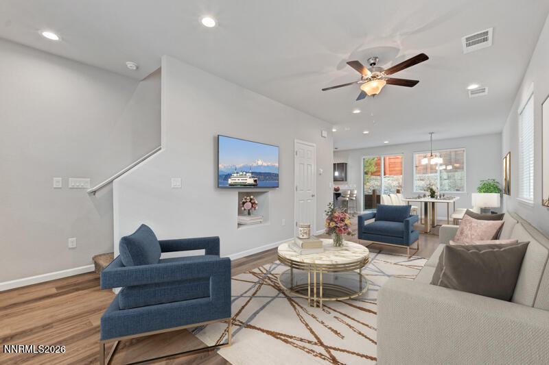 3622 Ruidoso Street Reno, NV 89512 - Photo 3 of 16 a living room with furniture a rug and a chandelier
