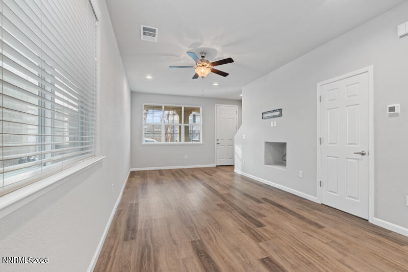 3622 Ruidoso Street Reno, NV 89512 - Photo 9 of 16 wooden floor in an empty room with a window