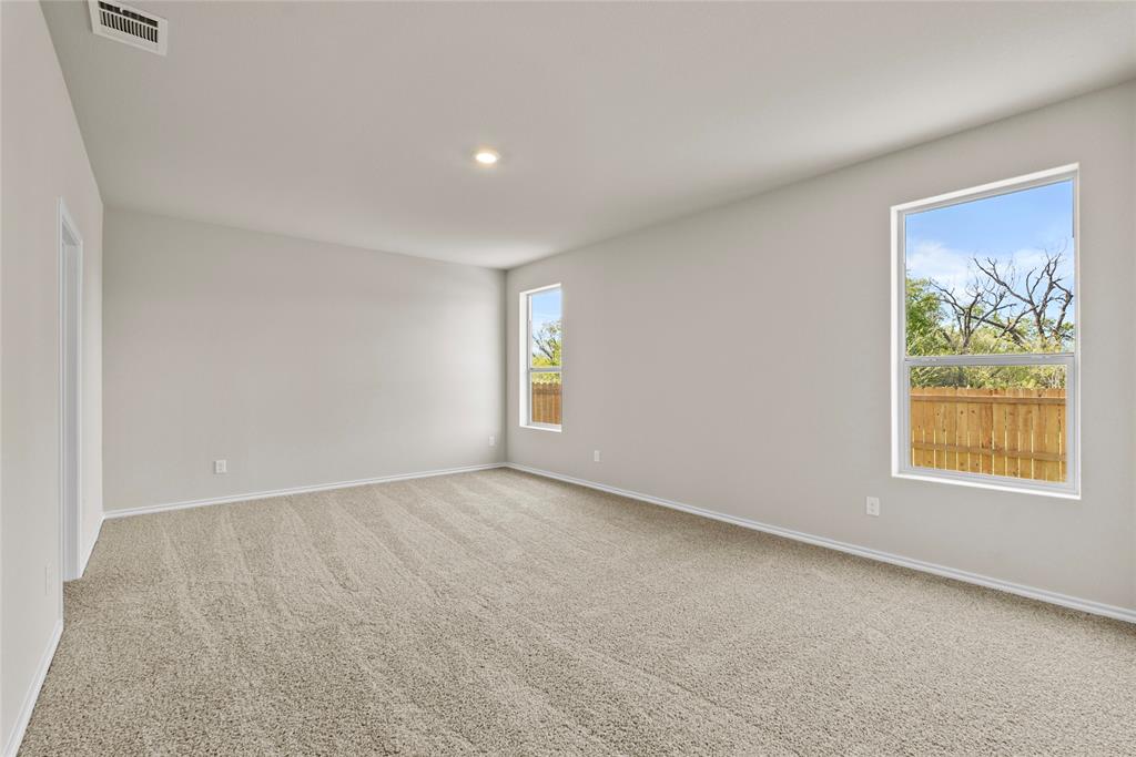 904 Traction Trail Cleburne, TX 76031 - Photo 12 of 27 an empty room with windows